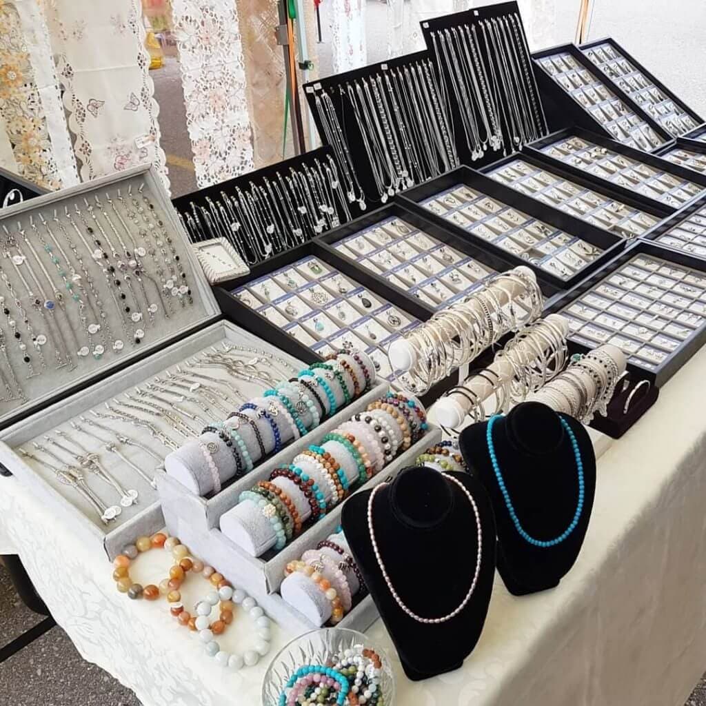 A display of beaded bracelets and other jewelry