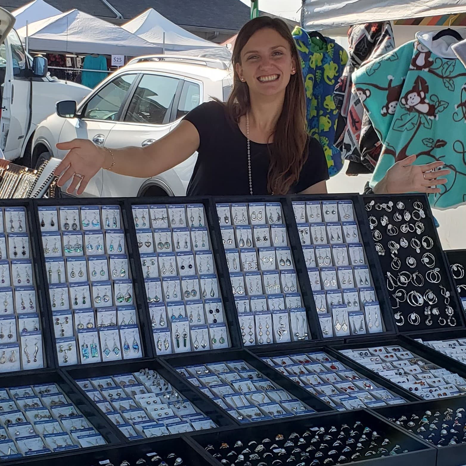 Snazzy Stones owner Brianna presenting her market booth